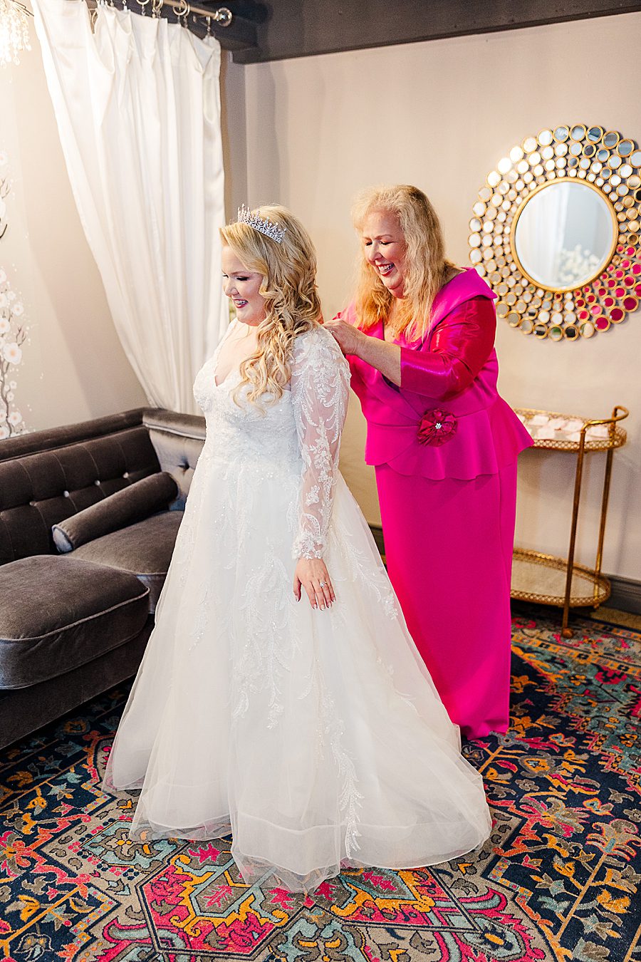 mom helping bride get ready at the brookside