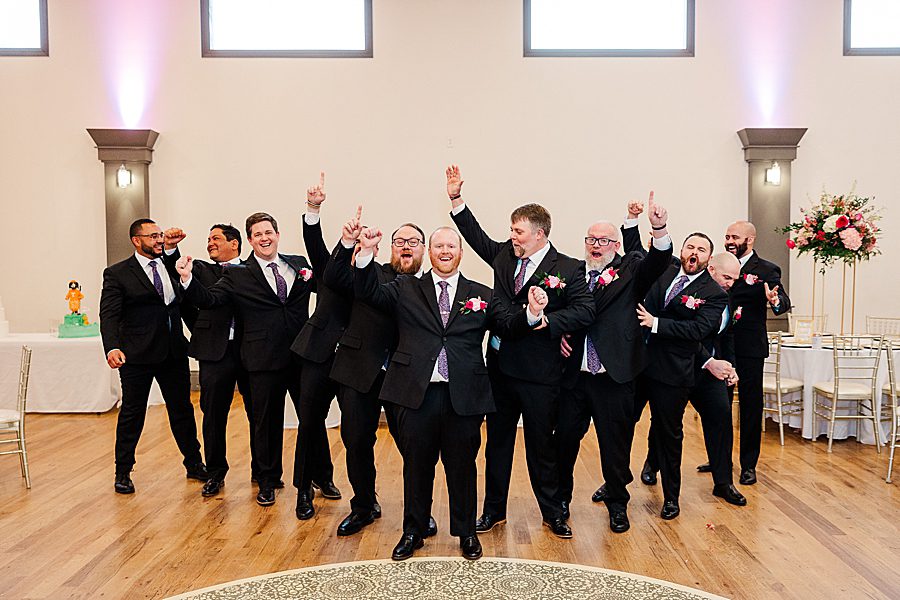 groom and groomsmen at the brookside