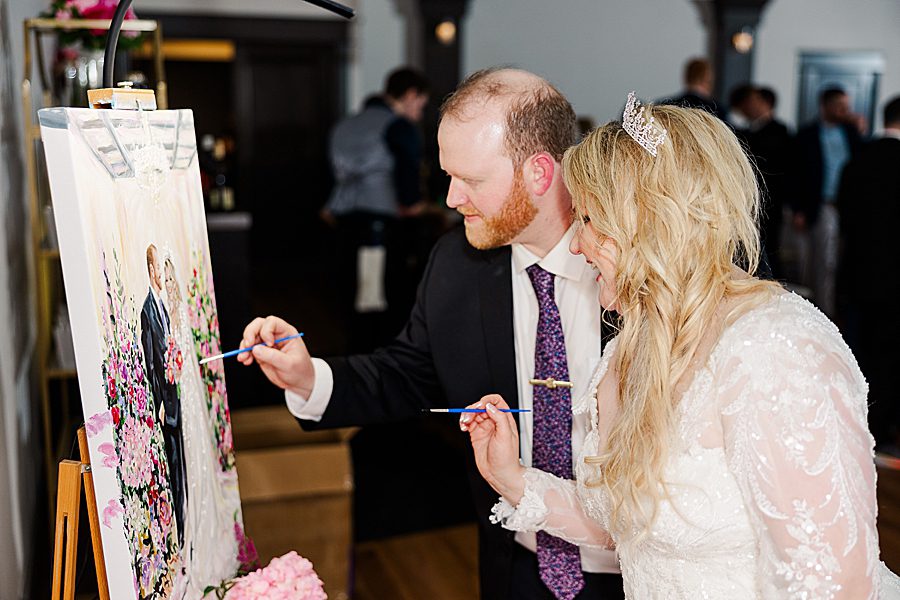 bride and groom painting