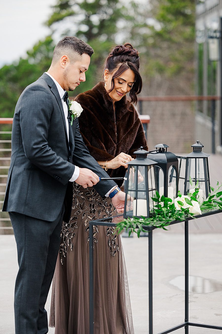 lighting candles at winter trillium wedding