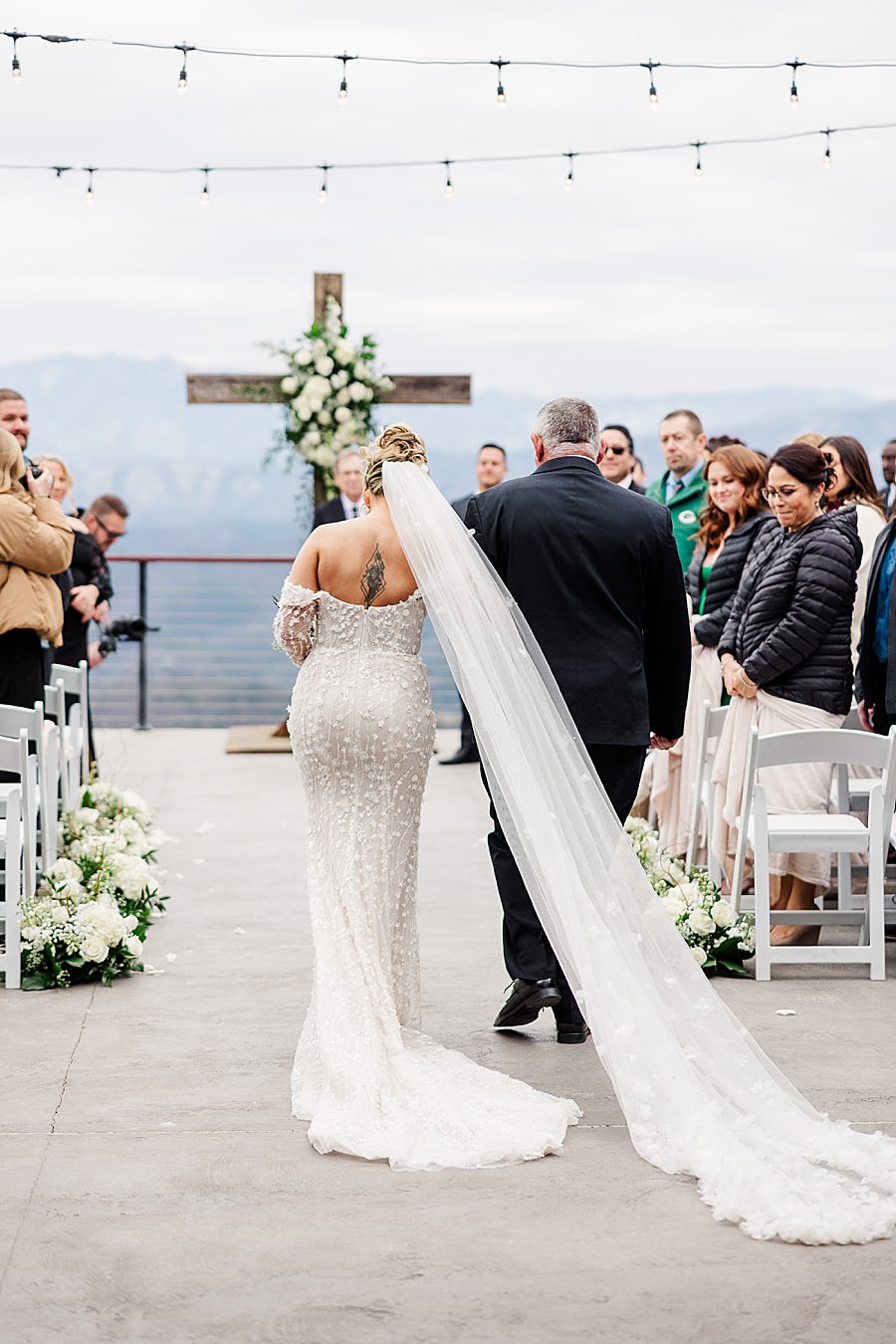 bride walking down aisle at winter trillium wedding