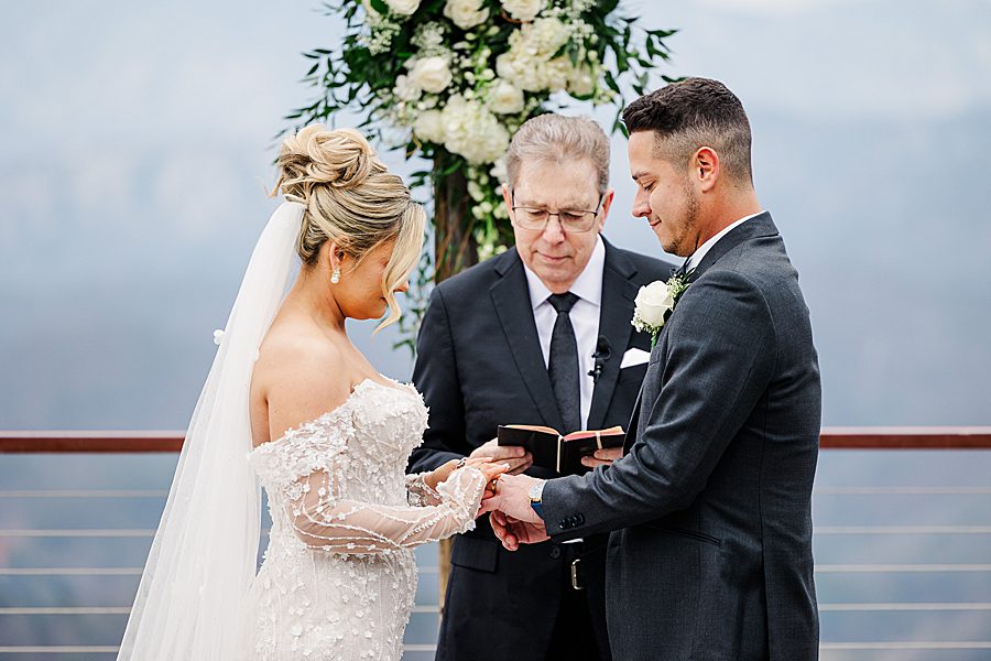 exchanging rings at winter trillium wedding