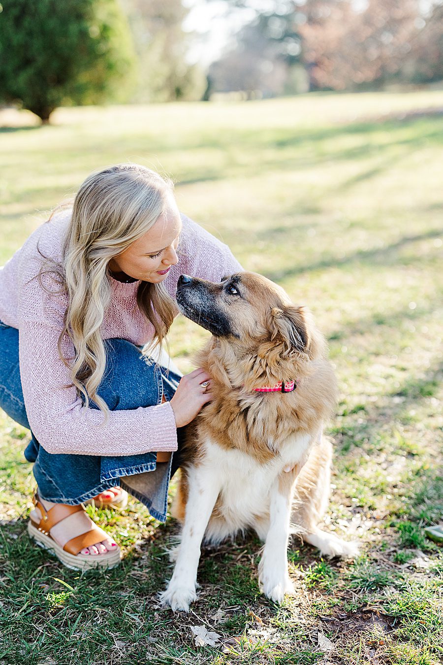 woman and dog at golden hour