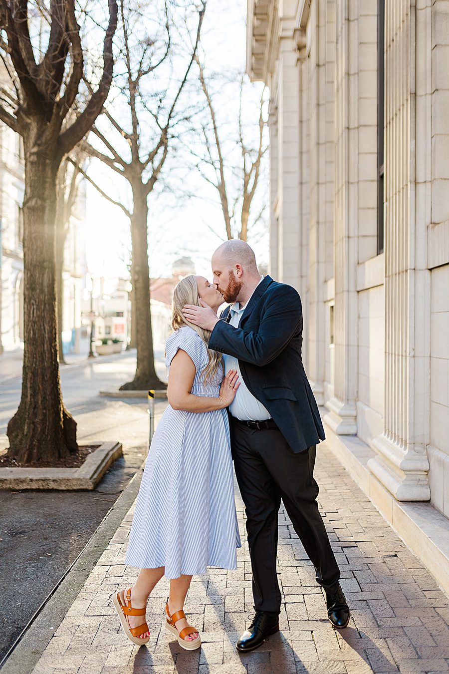 couple kissing at golden hour