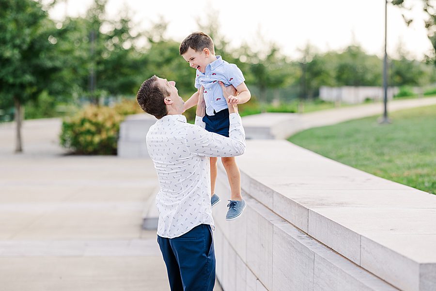 dad and son playing at lakeshore maternity session