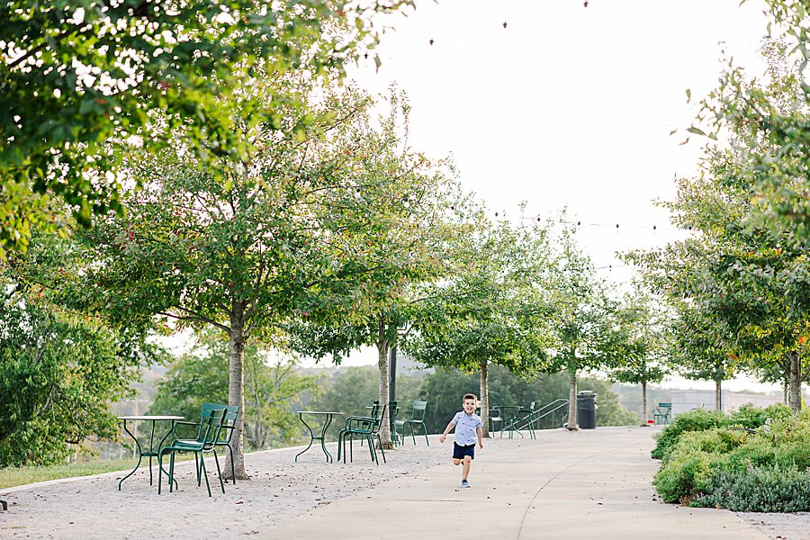 boy running through park
