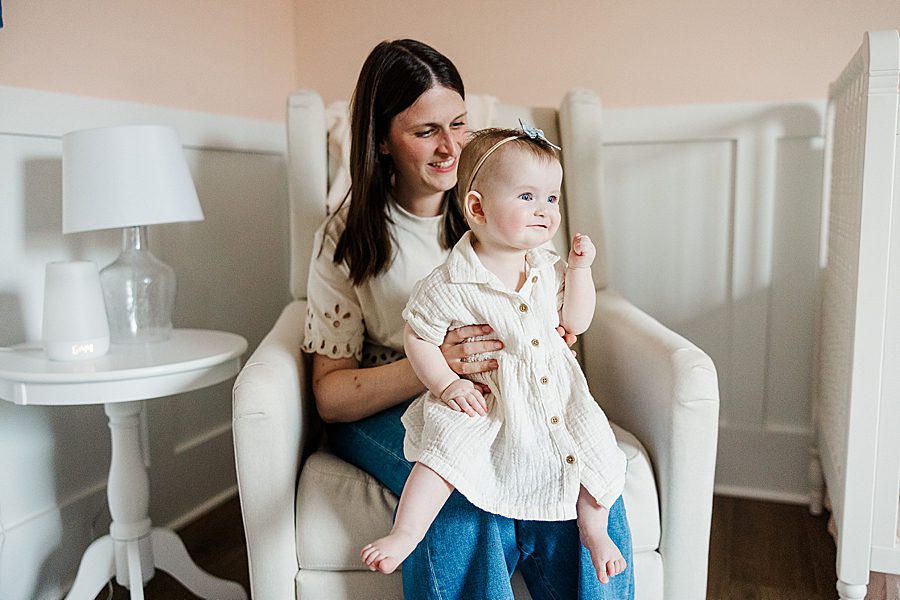 mom holding daughter at lifestyle family session