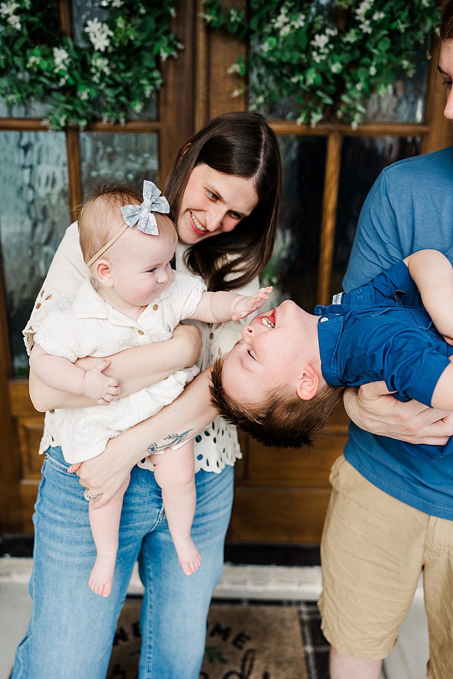 family of four on front porch
