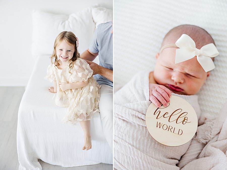 baby holding hello world sign