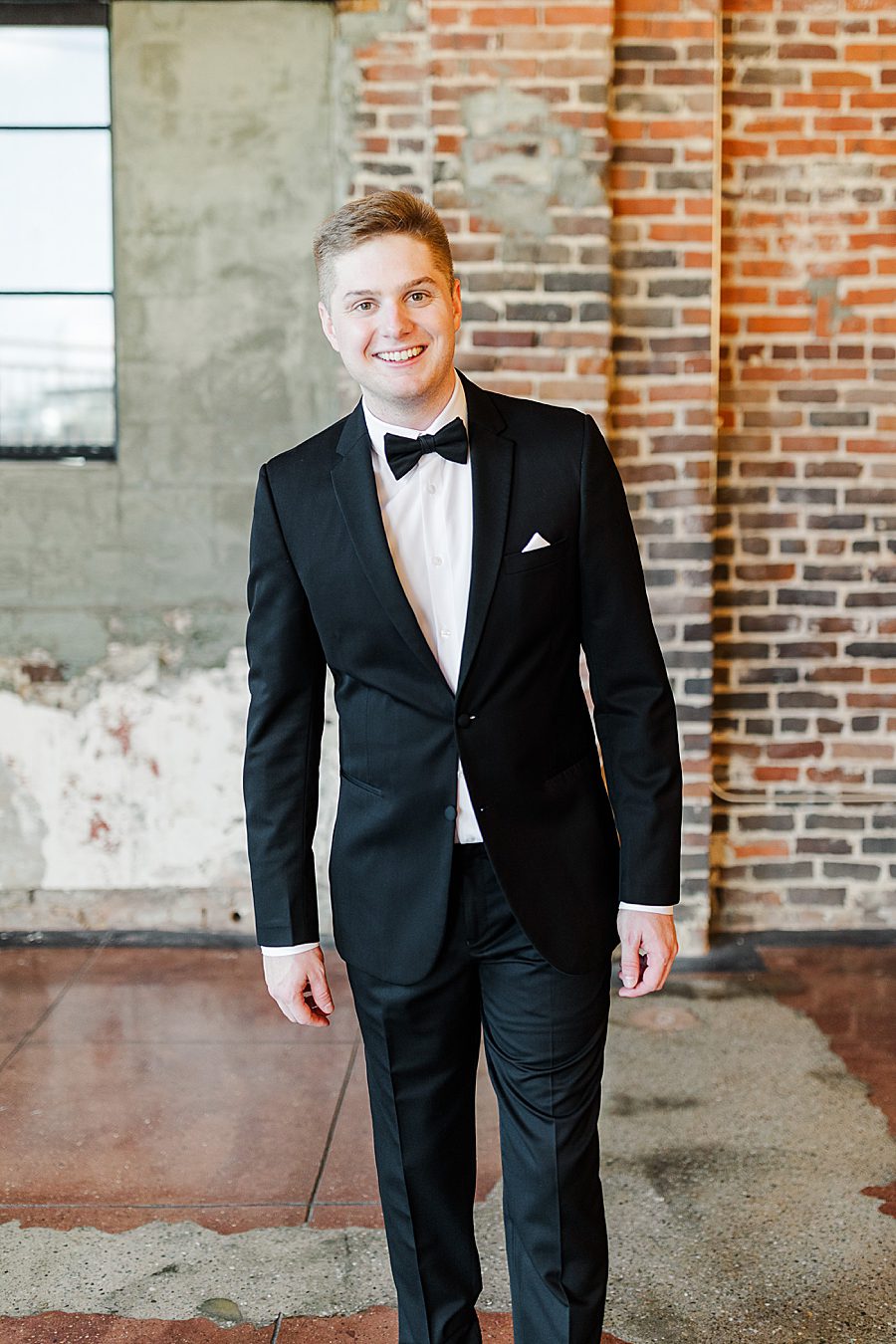 groom at summer press room wedding