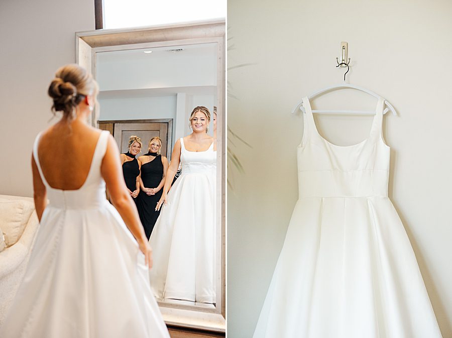 bride looking in mirror at summer press room wedding