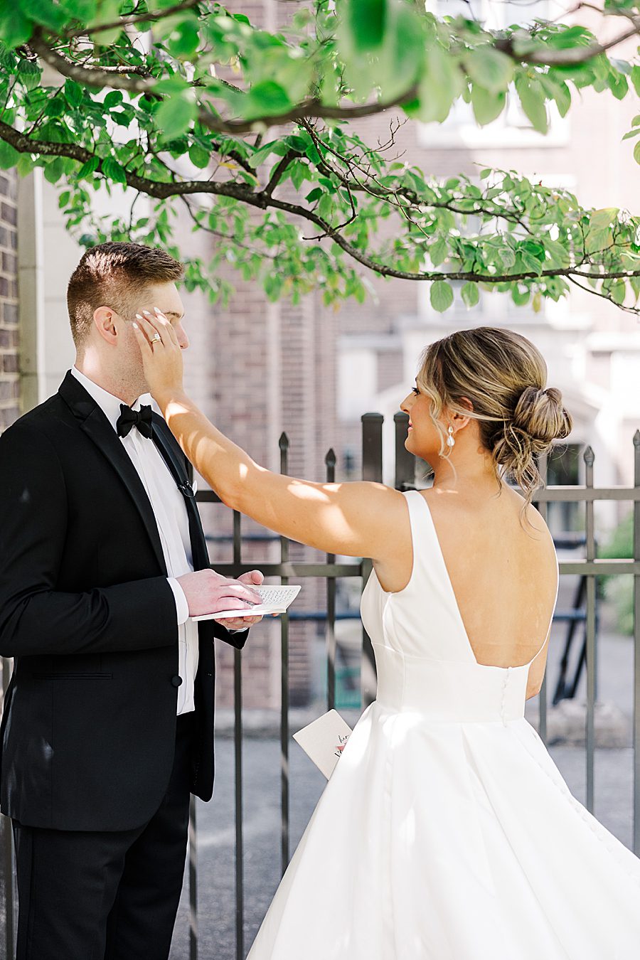 wiping tears at summer press room wedding