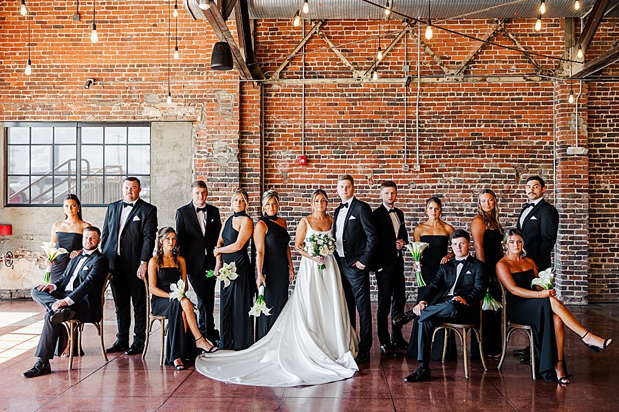 bridal party posed at summer press room wedding