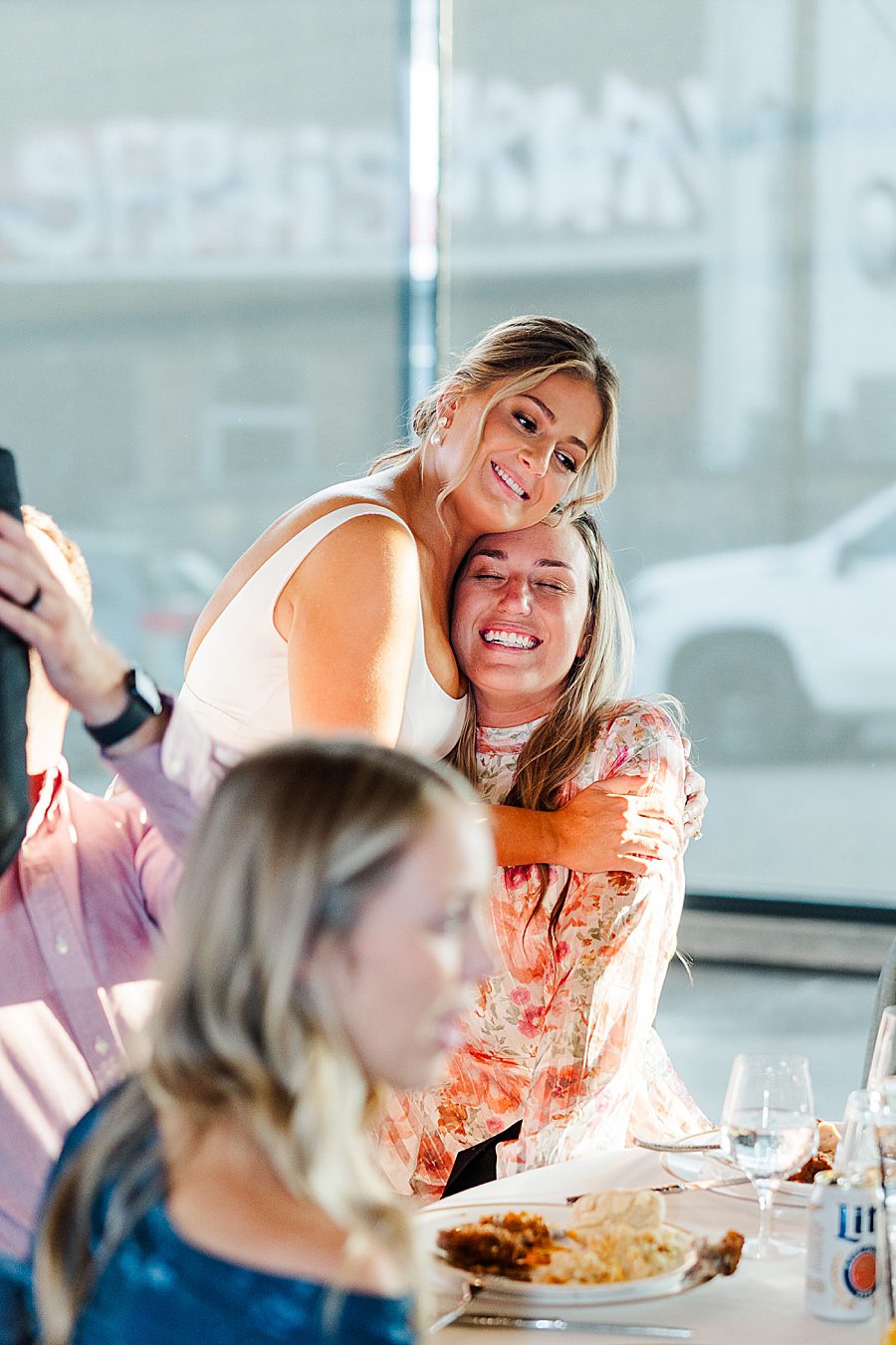 bride hugging guest