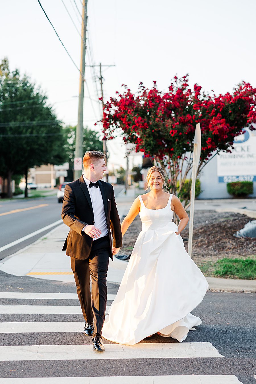couple running across street