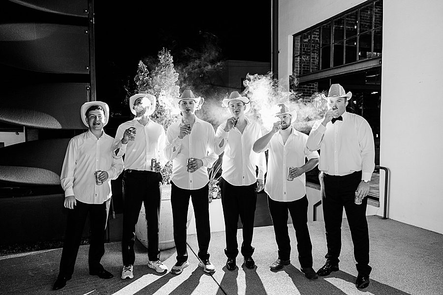 groomsmen smoking cigars