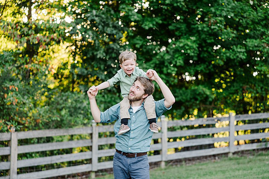 son on dad's shoulders