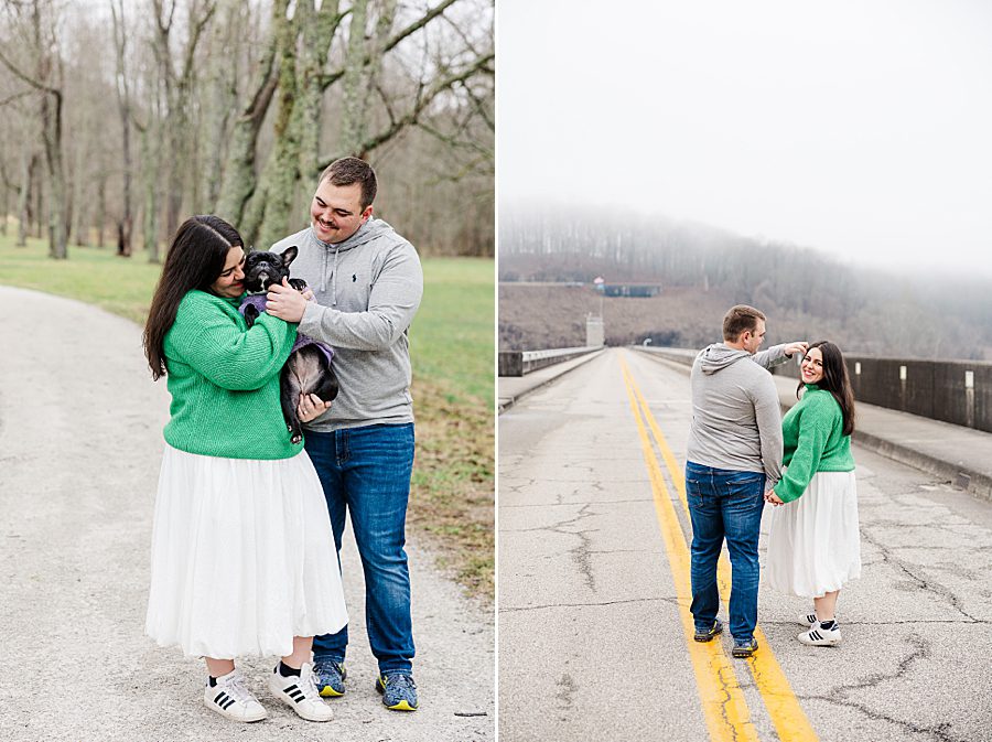 couple snuggling with french bulldog