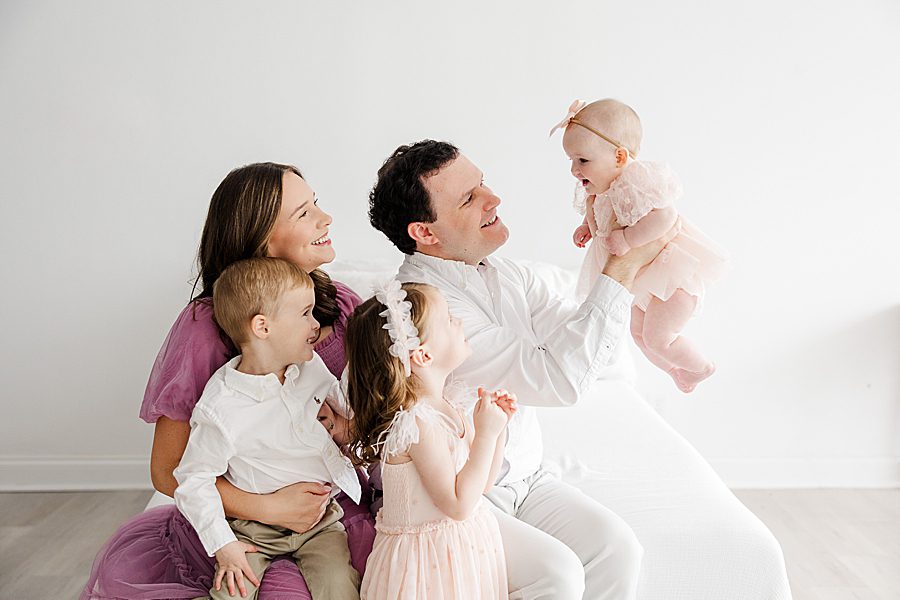 family of 5 at white room 6 month session