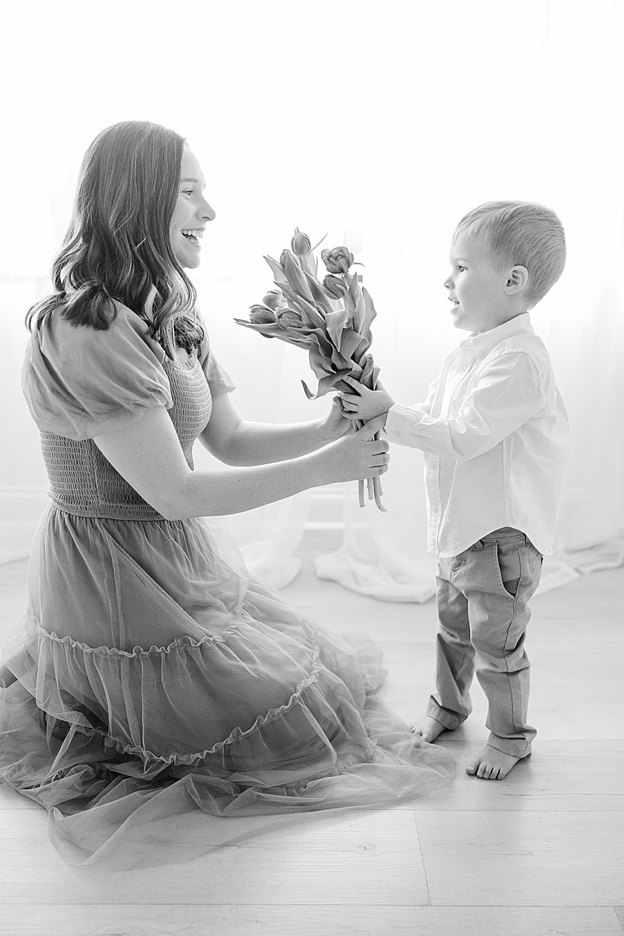 black and white photo at white room 6 month session