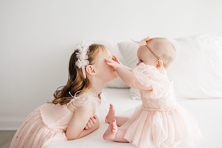 sisters at white room 6 month session