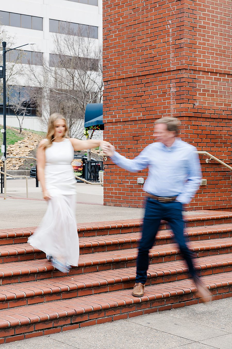 blurred action photo of spring downtown knoxville engagement