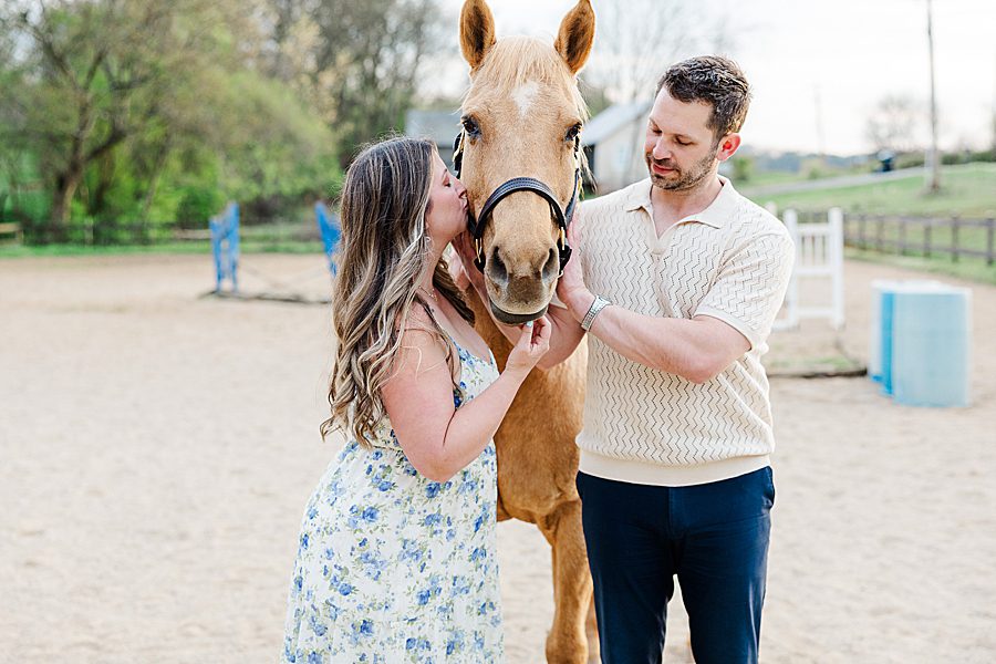 couple petting horse