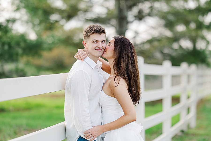 woman kissing man on cheek 