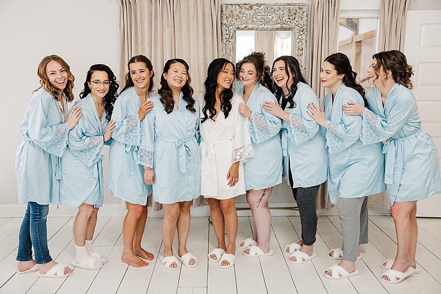 girls getting ready at rainy wedding at ramble creek
