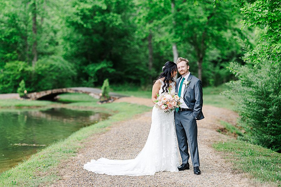 bride and groom photos at rainy wedding at ramble creek