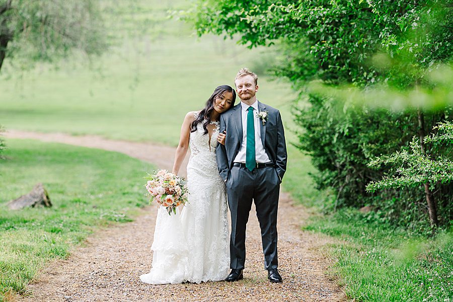 head on shoulder at rainy wedding at ramble creek