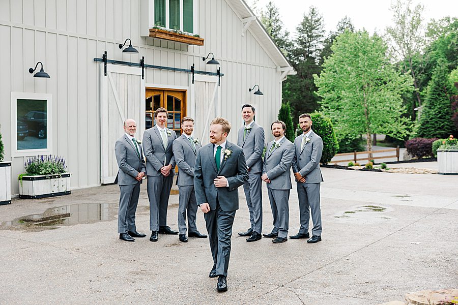 groom and groomsmen at rainy wedding at ramble creek