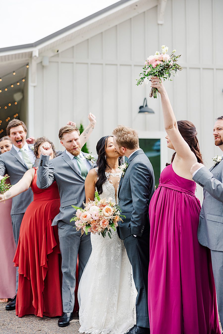 couple and wedding party at rainy wedding at ramble creek