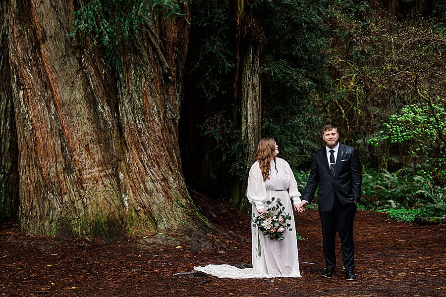 bride and groom holding hands 