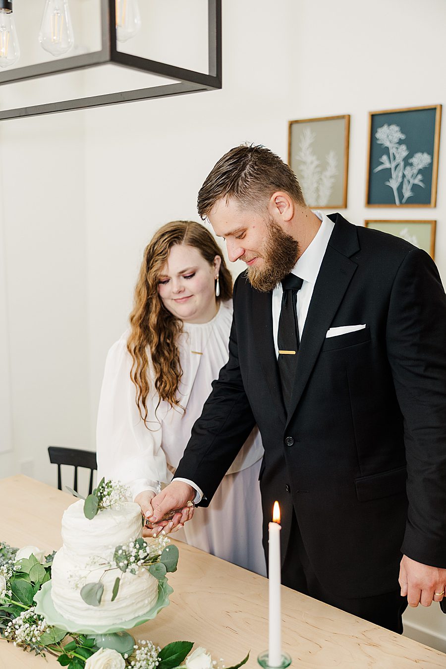 bride and groom cutting cake