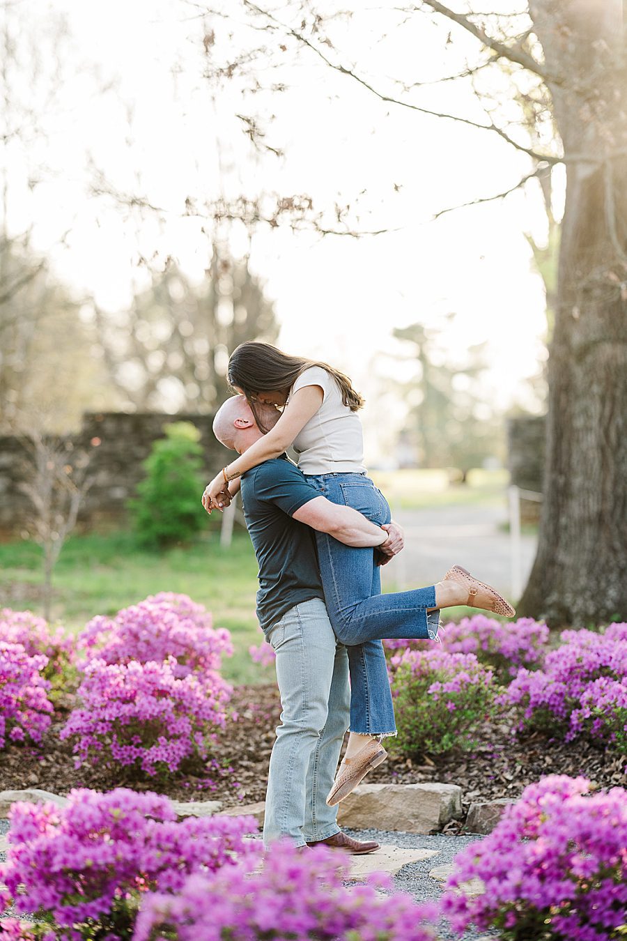 lift kiss at spring engagement at knoxville botanical
