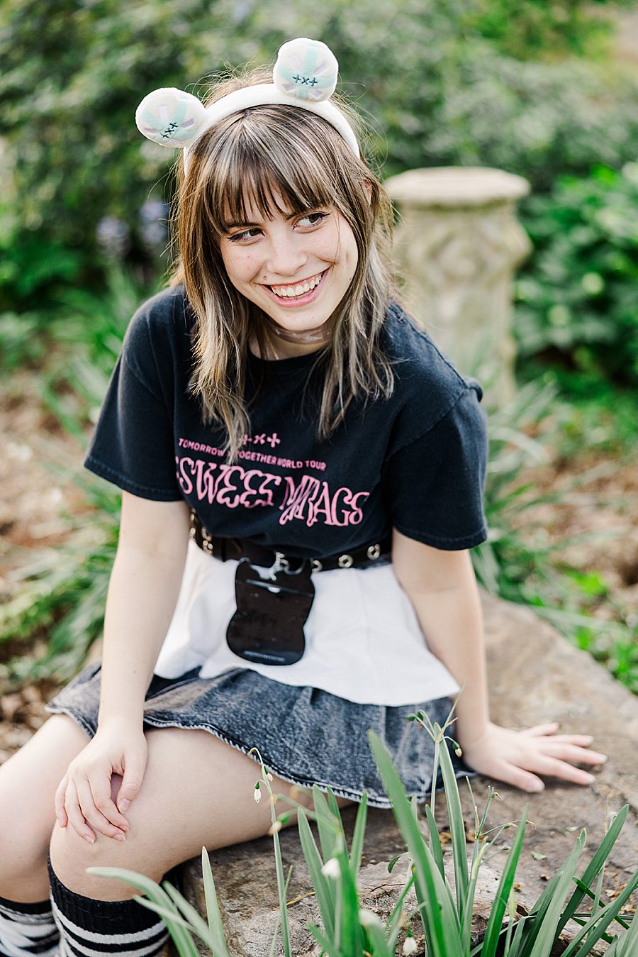 girl sitting on rock