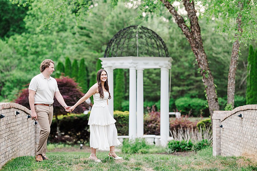 couple holding hands and walking together