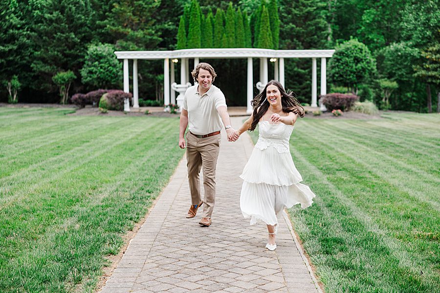 couple running down aisle
