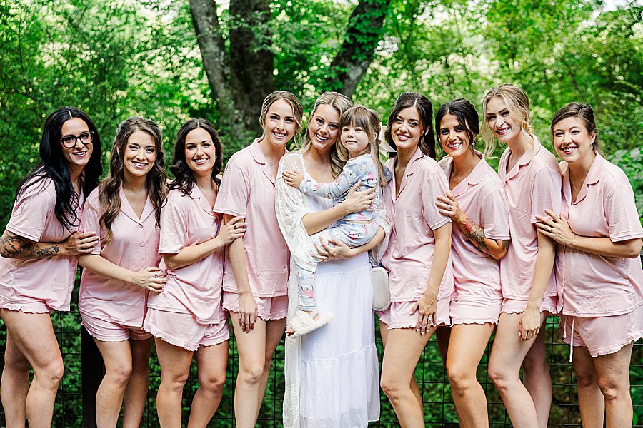 bride and bridesmaids in matching robes before dancing bear wedding