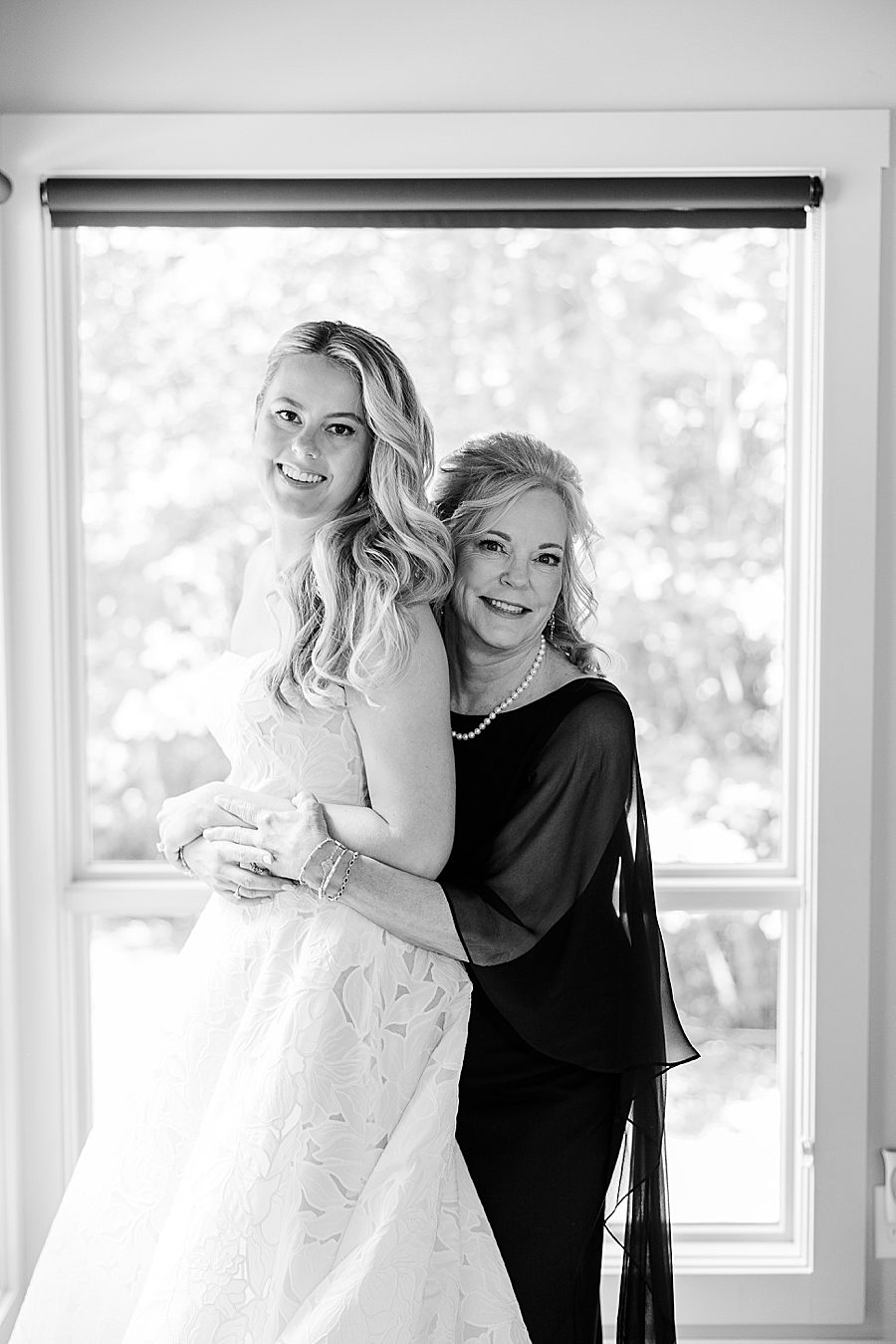 black and white photo of bride and mom before dancing bear wedding