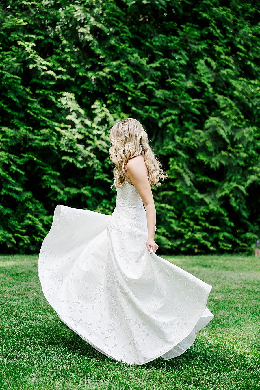 bride twirling in wedding dress at dancing bear wedding