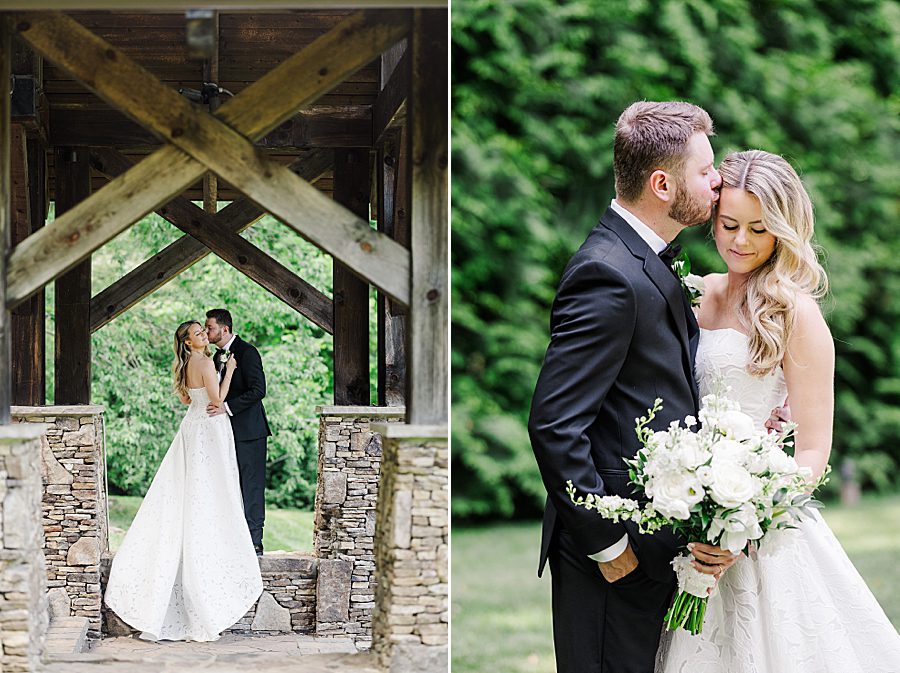groom kissing bride's forehead at dancing bear wedding