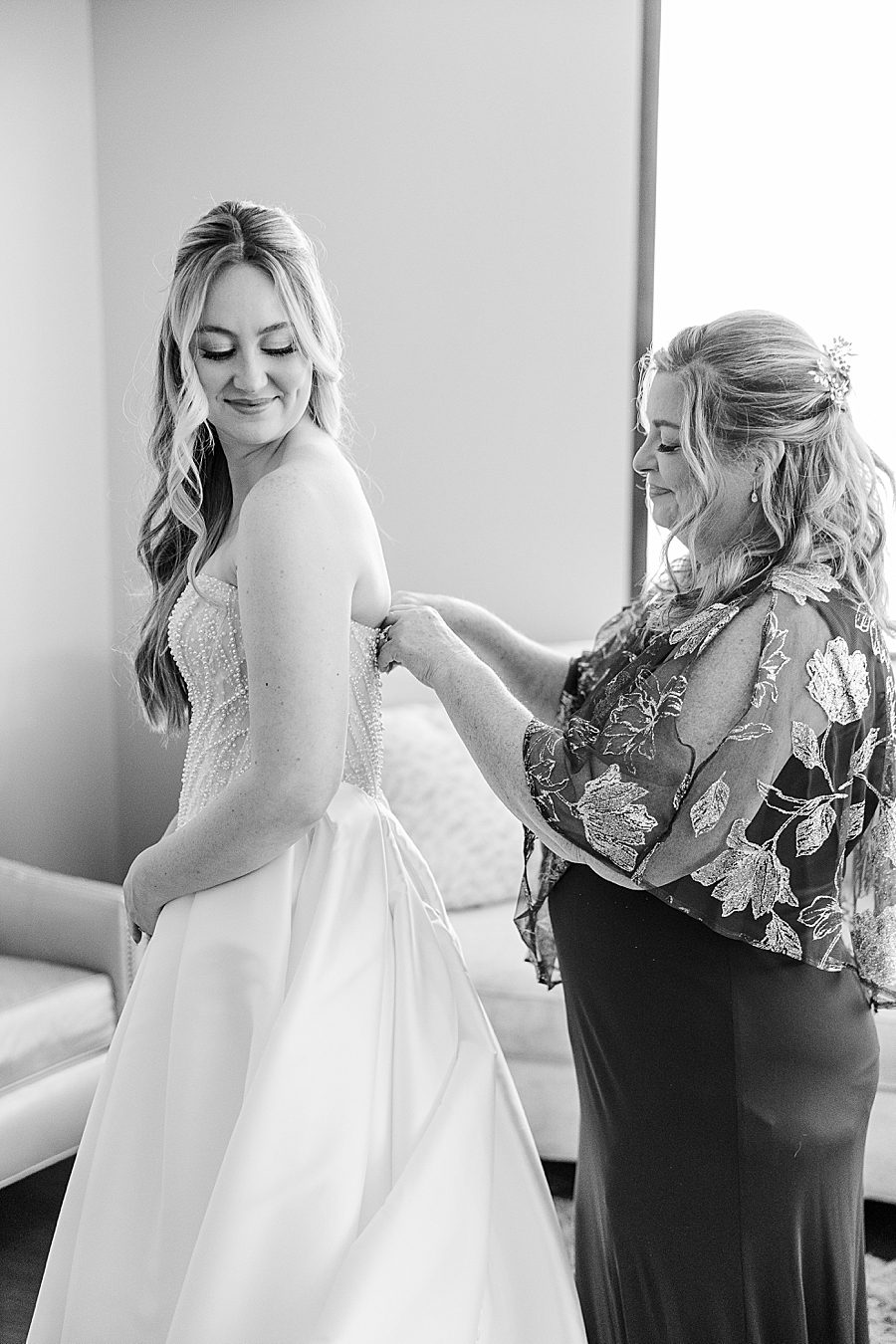 zipping dress at press room catholic wedding