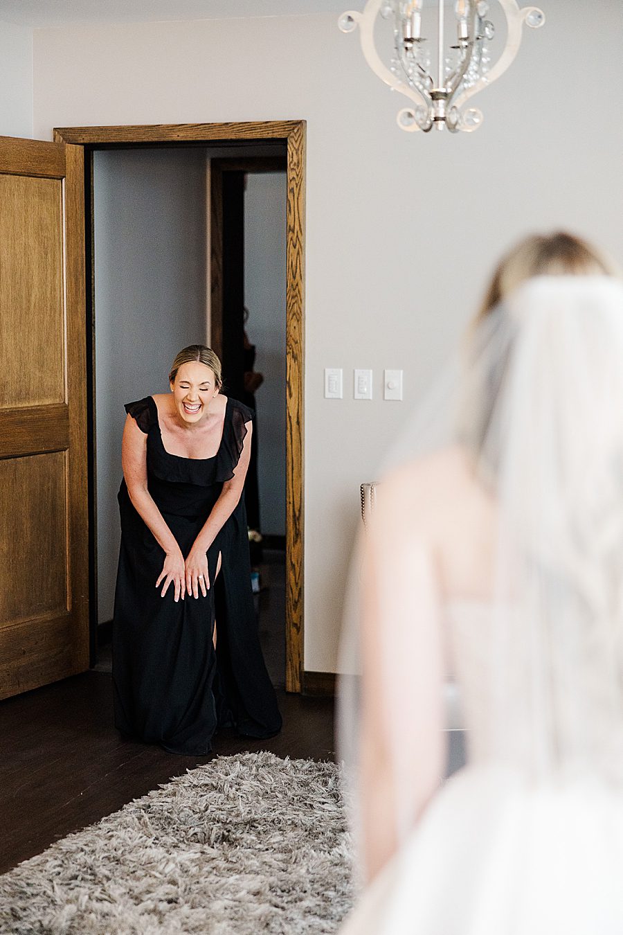 bridesmaid first look at press room catholic wedding