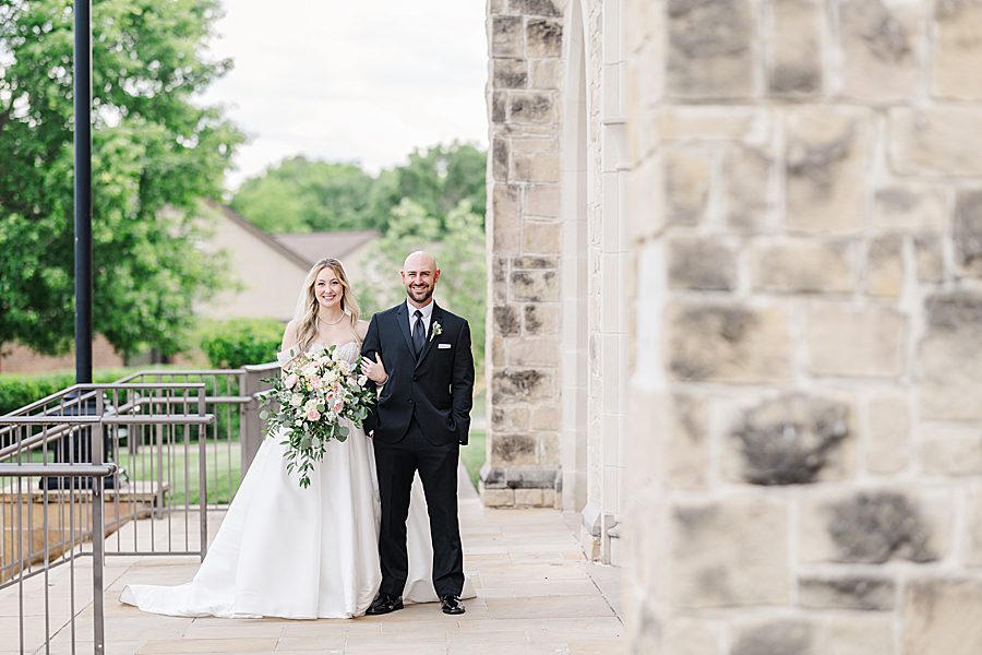 happy couple at press room catholic wedding