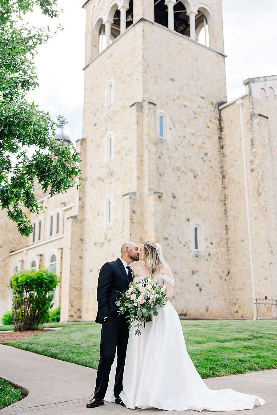couple in front of st john neumann