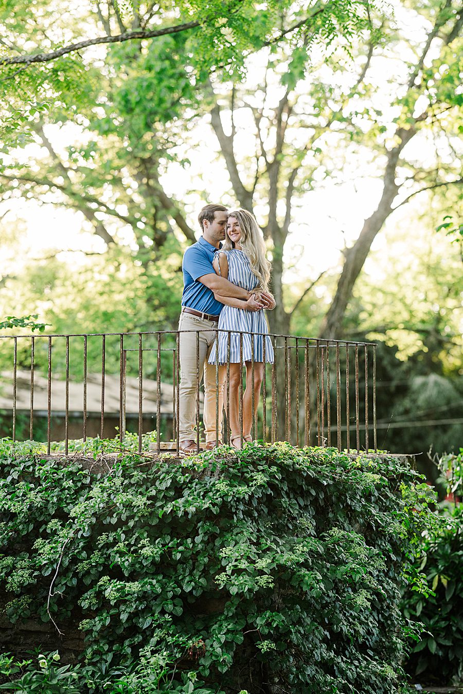 couple standing on garden balcony