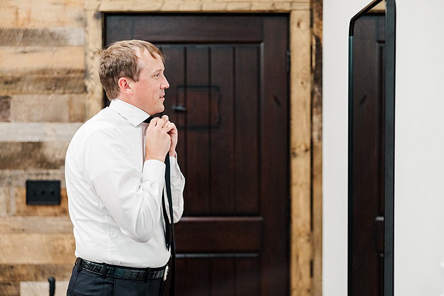 groom getting ready for trailhead venues wedding