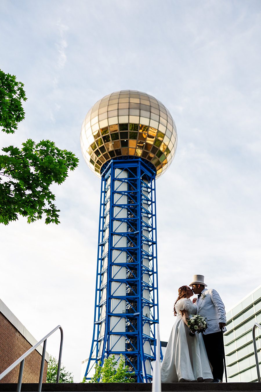 couple and sunsphere at world's fair site anniversary session